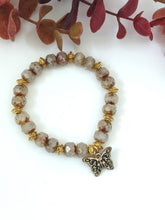 Load image into Gallery viewer, Crystal And Gold Stretch Bracelet With A Celtic Charm