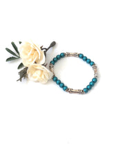 Load image into Gallery viewer, Matte Blue Crystal And Silver Lotus Bead Bracelet