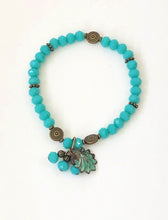 Load image into Gallery viewer, Blue Crystal Beaded Bracelet With Patina Finished Shell Charm