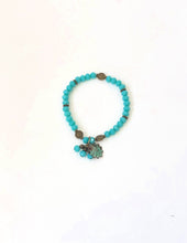 Load image into Gallery viewer, Blue Crystal Beaded Bracelet With Patina Finished Shell Charm