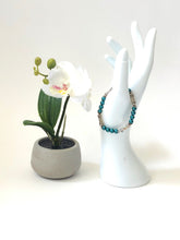 Load image into Gallery viewer, Matte Blue Crystal And Silver Lotus Bead Bracelet