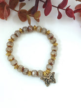 Load image into Gallery viewer, Crystal And Gold Stretch Bracelet With A Celtic Charm
