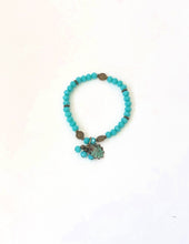 Load image into Gallery viewer, Blue Crystal Beaded Bracelet With Patina Finished Shell Charm
