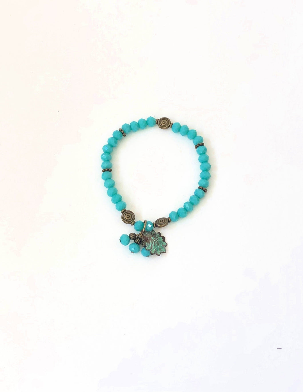 Blue Crystal Beaded Bracelet With Patina Finished Shell Charm