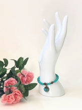 Load image into Gallery viewer, Blue Crystal Beaded Bracelet With Patina Finished Shell Charm

